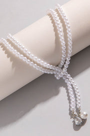 Collier à pampilles en perles avec accents géométriques