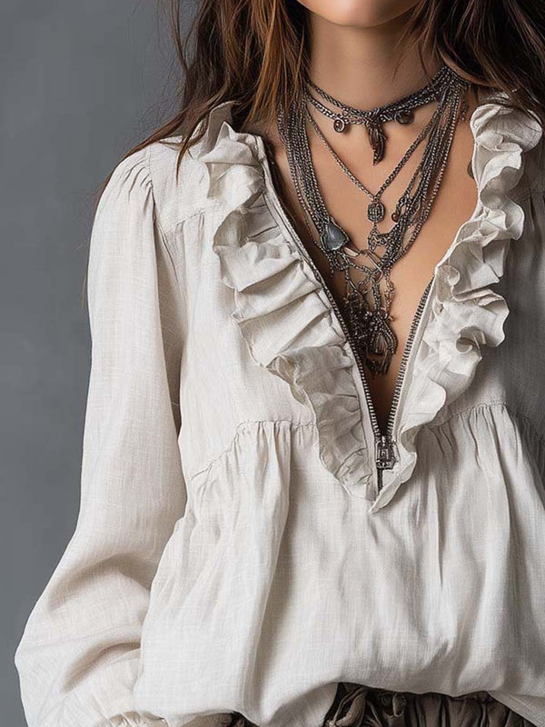 Blouse en coton et lin avec col zippé et détails volants