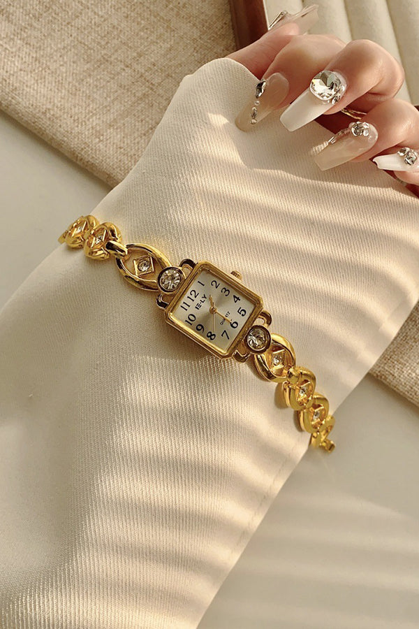 Montre à quartz dorée vintage avec boîtier en alliage et boucle pliante