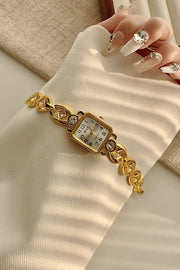 Montre à quartz dorée vintage avec boîtier en alliage et boucle pliante