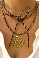 Collar de acero inoxidable con espiral y cordón de cuero con estampado de leopardo