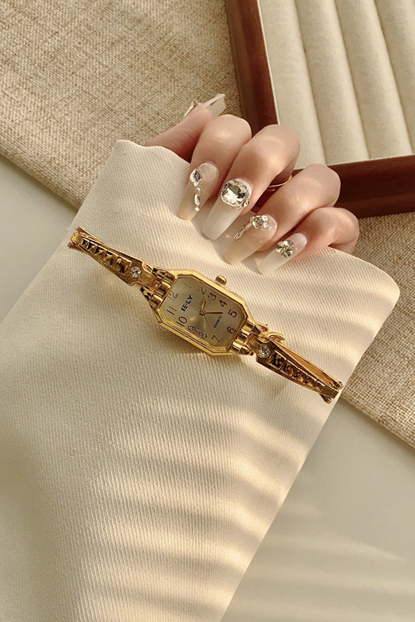 Montre à quartz dorée vintage avec boîtier en alliage et boucle pliante